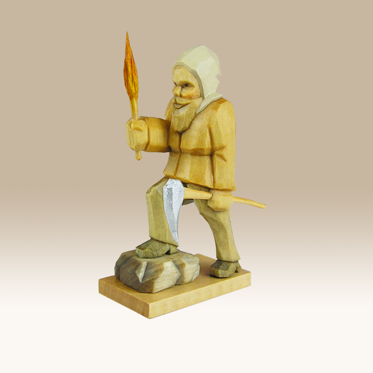 Geschnitzter Bergmann mit Fackel