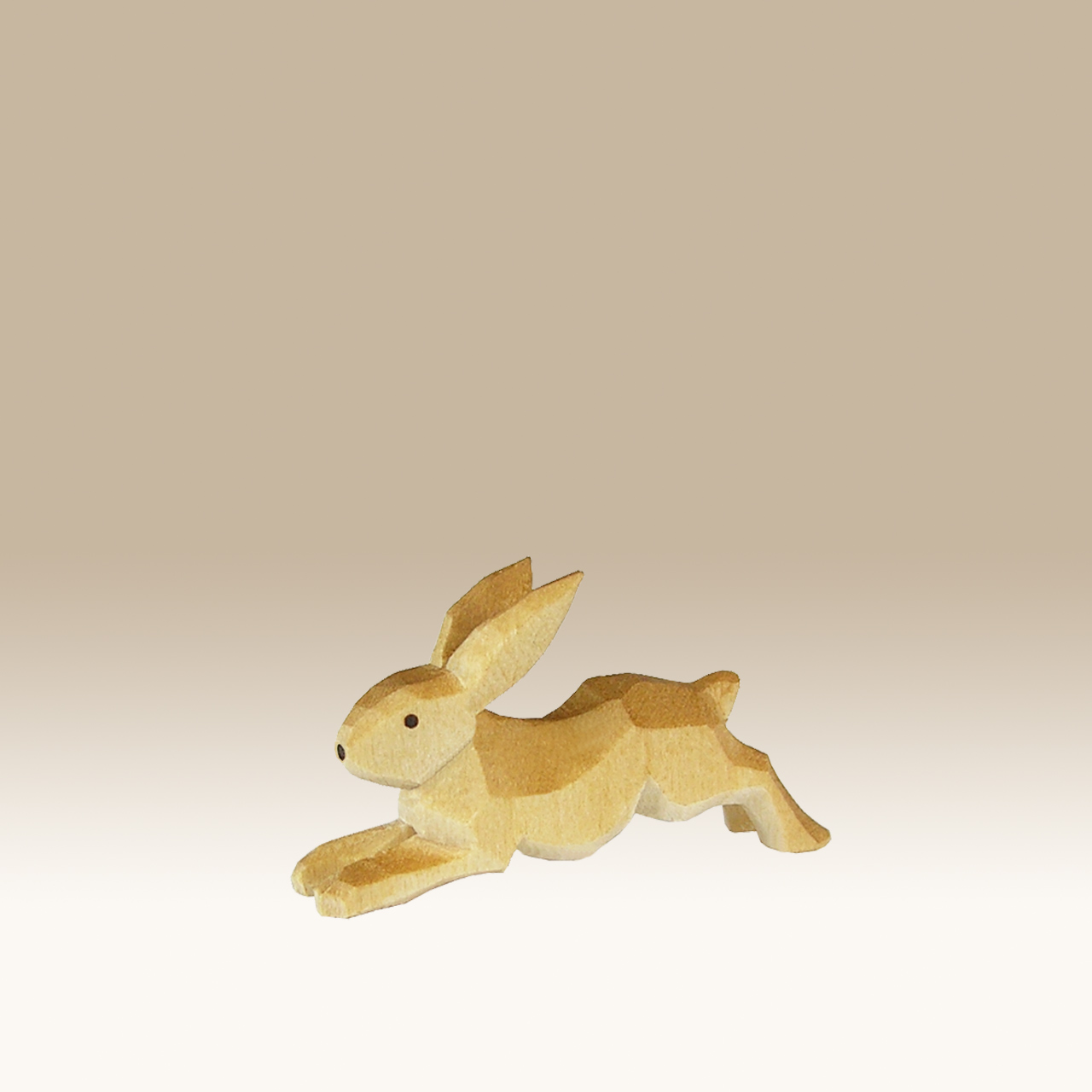 Geschnitzter Hase, flüchtend
